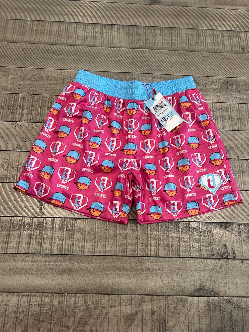 Girls' Pink Swim Shorts with Light Blue Waistband - Sports Print